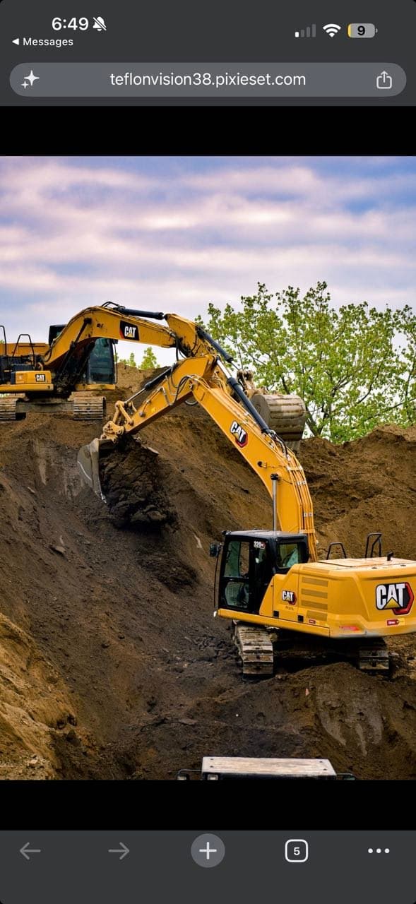 Two CAT excavators performing high-production earthmoving and site excavation